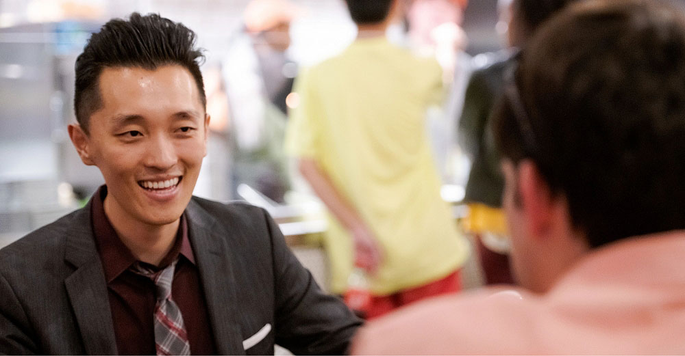 Professional man having a conversation with someone and smiling
