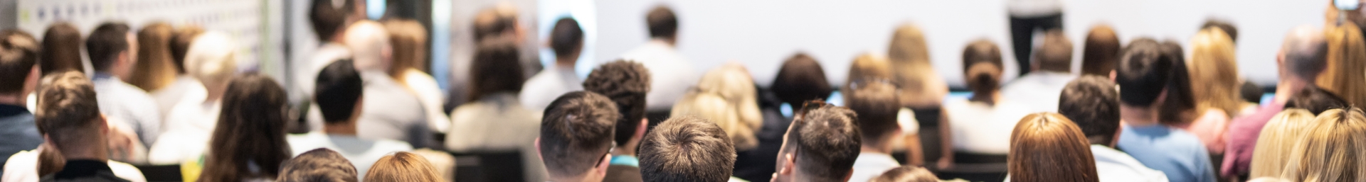 Group of people watching a lecture